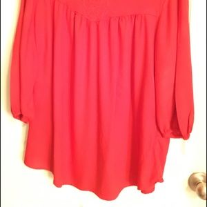 Red empire gathered embroidered neckline.